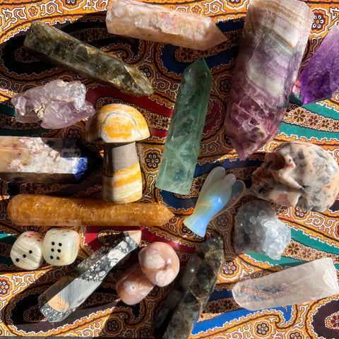 A potpourri of semiprecious crystals and stones available at Coven & Cloche including Agate, Fluorite, Labradorite, Sodalite, Citrine, Celestine, Amethyst, in traditional tower point obelisks and hand carved shapes.